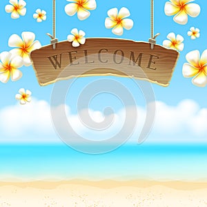 Signboard Welcome anf flowers on tropical beach photo
