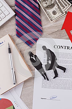 Signed contract in focus.