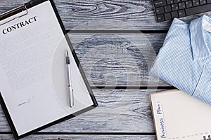 Signed contract and office items.