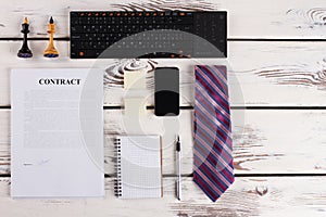 Signed contract with office items.