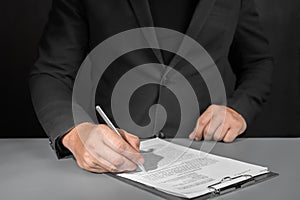 Signing contract, business agreement and deal concept. Closeup businessman reading before signing business contract documents
