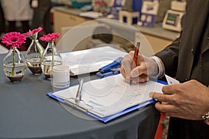 Signing a contract on a fair