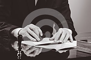 Signing contract. Lawyer or notar on his workplace photo