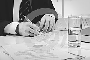 Signing contract. Lawyer or notar on his workplace photo