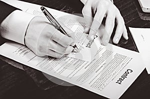 Signing contract. Lawyer or notar on his workplace photo