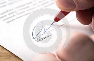 Signing contract, lease or settlement for acquisition, apartment lease, insurance, bank loan, mortgage or business buyout.