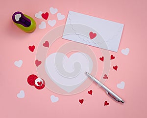 Signing Handmade Valentine cards. Felt, silver pen, white envelope.