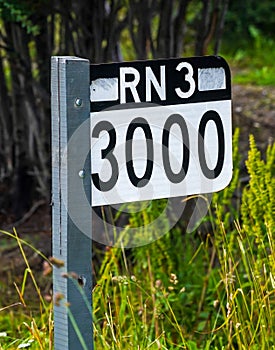 Signpost 3000 km till the end in Buenos Aires at the National Route 3