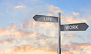 Signpost against summer sky, space for text. Concept of balance between work and life