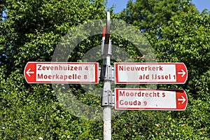 Signpost for cyclists after all villages In the municipality of Zuidplas such as Zevenhuizen moerkapelle Nieuwerkerk and photo