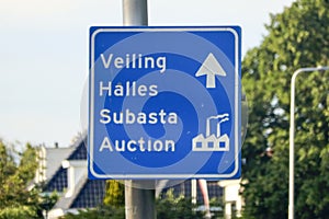 Signpost in four languages to vegetable auction in Bleiswijk