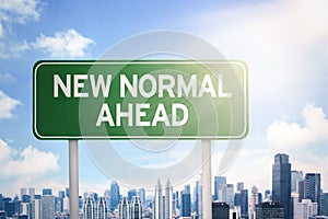 Signpost with New Normal Ahead text photo