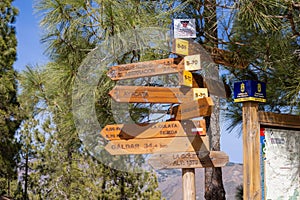 Signpost in the Parque Rural del Nublo, Roque Nublo at the back, Gran Canaria, Canary Islands, Spain