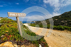 Signpost pointing to the beach at La Revellata in Corsica