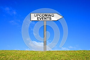 Signpost showing Upcoming Events