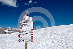 Signpost in snowy Alpine mountains - Madonna di Campiglio ski ce