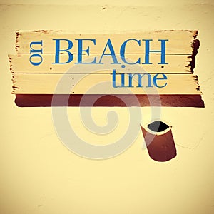 Signpost with the text on beach time, with a retro look