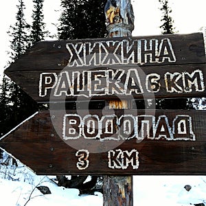 Signpost with three arrows on blue sky background. Closeup of crossroad sign