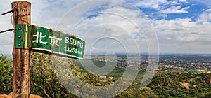 Signpost to Beijing on the hill near Gaborone city, Botswana