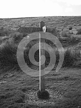 Signpost on walking paths shot in black and white