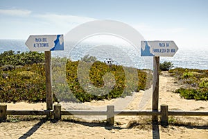 Signposts informing about two beaches called Alteirinhos and Zambujeira do Mar in Portugal photo