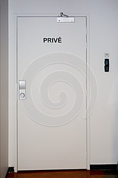 Signposts space reserved to authorized personnel on door