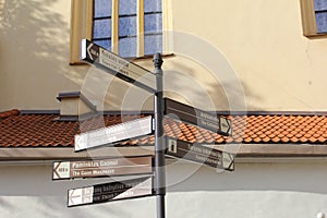Sign boards to famous tourist attractions in the historic town of Vilnius, Lithuania photo