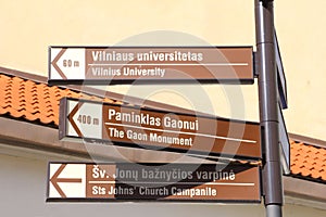 Signposts to tourist attractions in the Old town of Vilnius, Lithuania