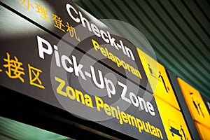 Signs at the airport Check-in and Pick-Up Zone