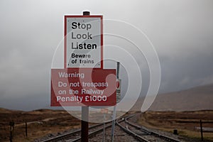 Signs at Corrour railway station, Scotland warning against trespass