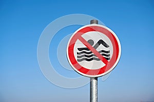 Signs erected at the end of the bathing season in Germany stating that bathing is prohibited