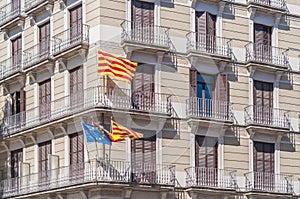 Signs and flags on Barcelona streets.