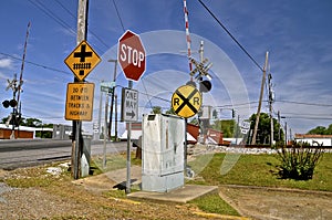 Signs in front of a railroad crossing