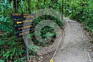 Signs at hiking trails in a cloud forest of Reserva Biologica Bosque Nuboso Monteverde, Costa Ri