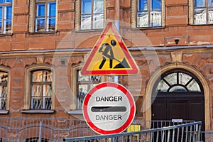 Signs informing about repair work and danger during street repair