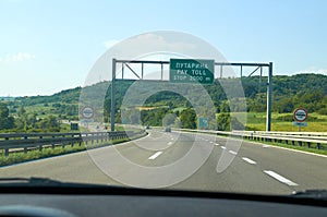 Signs for a pay toll