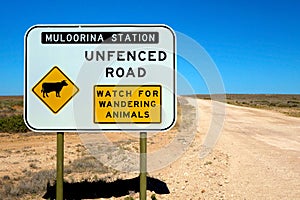 Warning sign regarding an unfenced road and the possibility of wandering animals on the road, Australia