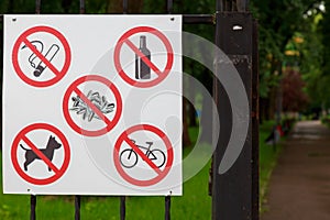 Signs with the rules of conduct in a public park. Background with copy space