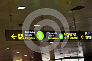 Signs of a Spanish airport dark background.