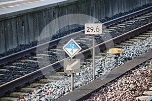 Signs for stop position and milage between tracks at the station of Dordrecht, the Netherlands