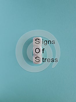 Signs of stress symbol. Concept words Signs of stress on wooden cubes.