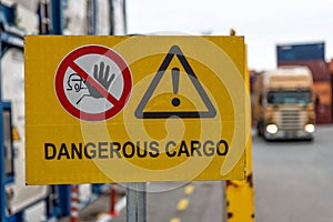 Signs warn of job security. Sign `dangerous cargo`.