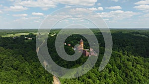 Sigulda, Latvia - 25 june 2022: On a summer day, a panoramic aerial view of Turaida Castle, which is built on a mountain i