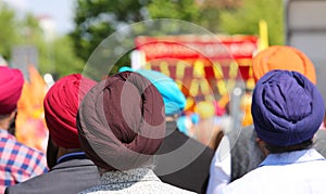 Sikh ethnic men wear colorful turbans to cover their hair