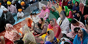 Sikh families inside a temple in Mallorca