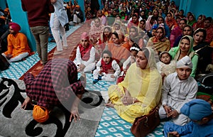 Sikh families inside a temple in Mallorca wide view