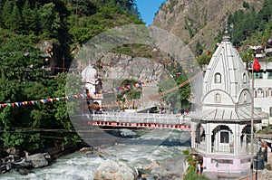 Sikh Gurudwara and a bridge across the river Parvati in the Himalayas. India