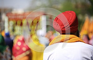 Sikh man with red turban outdoors photo