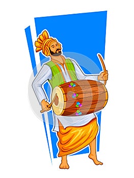 Sikh Punjabi Sardar playing dhol and dancing bhangra on holiday like Lohri or Vaisakhi photo