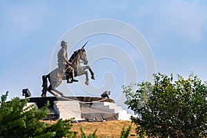 Sikh warrior bhai fateh singh statue sitting on the horse under blue sky background. historical concept